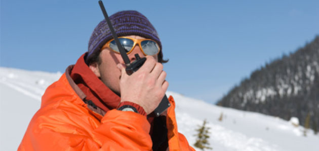 image of man using walkie talkie on mountain