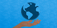 Hand holding a globe representative of Earth Day